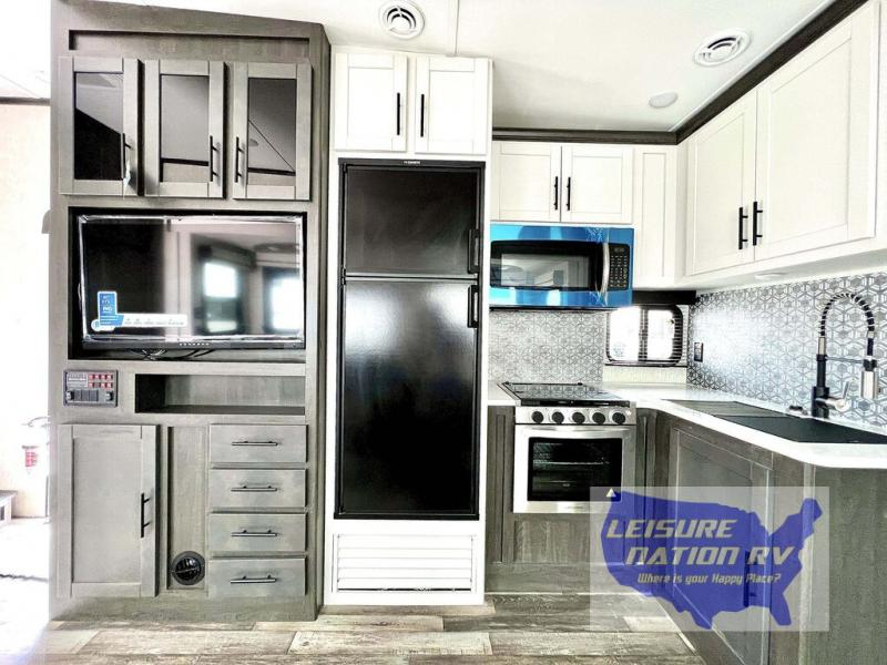The stainless steel appliances give this kitchen a high-end finish.