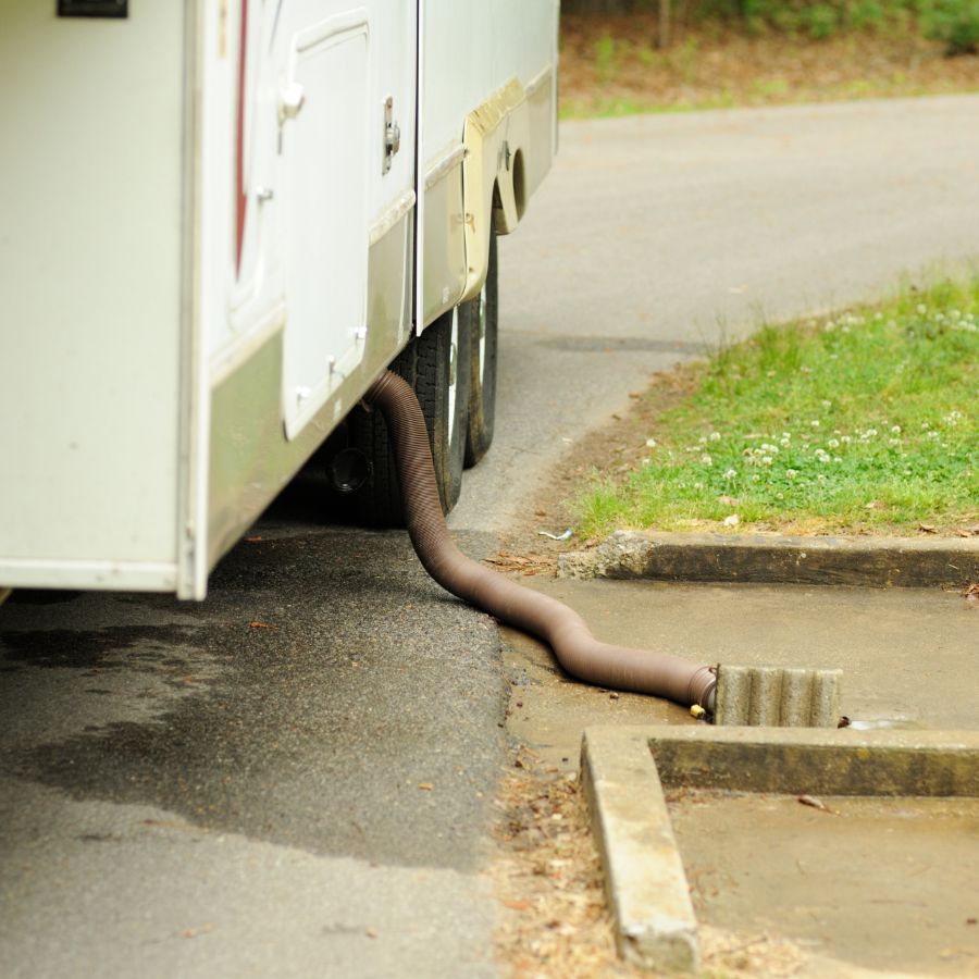 This sewage hose is not elevated properly and may lead to drainage problems.